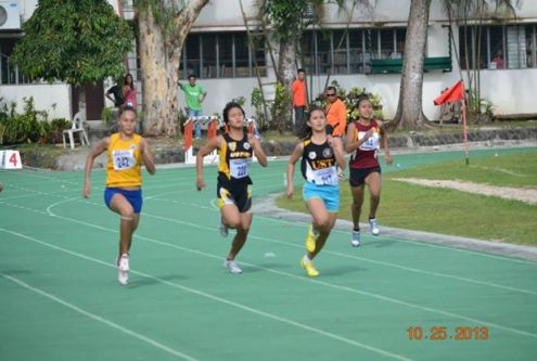 Salcedo in the centre, battles Josie Malacad yellow and Eloiza Luzon blue shorts in the 200m Dash at Uni Games.