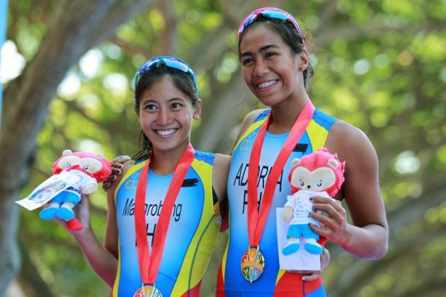 28th SEA Games Singapore 2015 - East Coast Park, Singapore - 6/6/15 Triathlon - Women's Individual - Philippines' Ma Claire Adorna (R) and Marion Kim Mangrobang hold their gold and silver medals respectively SEAGAMES28 Mandatory Credit: Singapore SEA Games Organising Committee / Action Images via Reuters